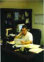 John at desk.JPG (7623 bytes)